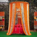 Yellow & Orange Marigold Tassels Mehendi Backdrop with Ceiling Flower Work by Wedding Decor by Gaur